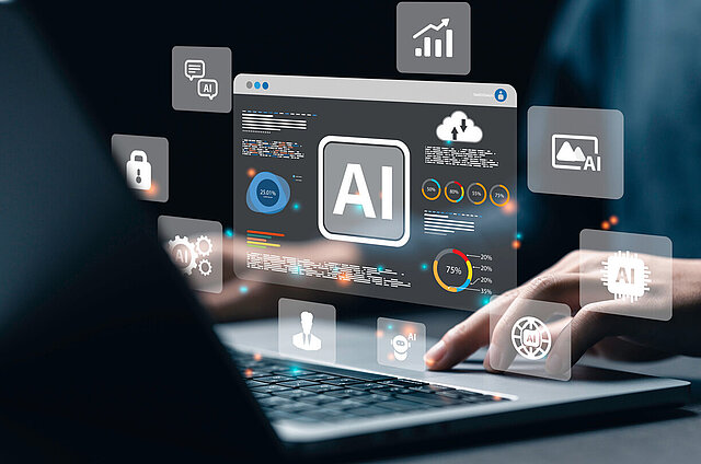 Mann am Laptop mit einer grafischen Oberfläche, wie künstliche Intelligenz in verschiedene Prozesse reinspielt.